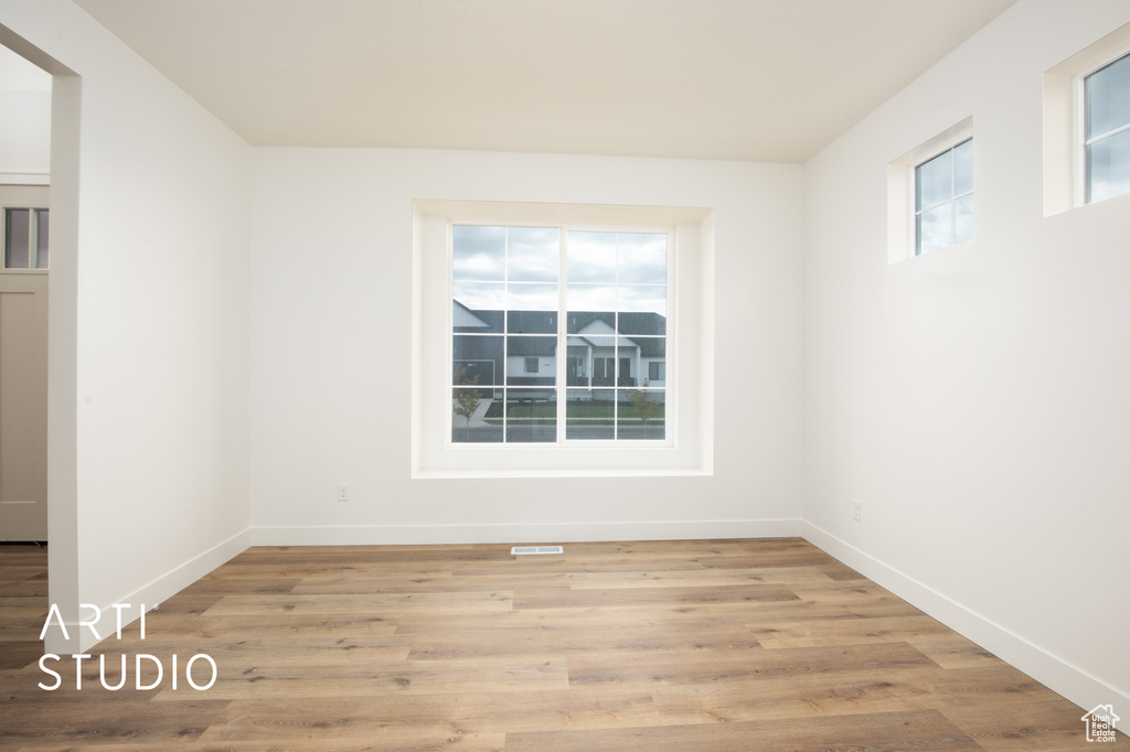 Unfurnished room featuring light hardwood / wood-style floors