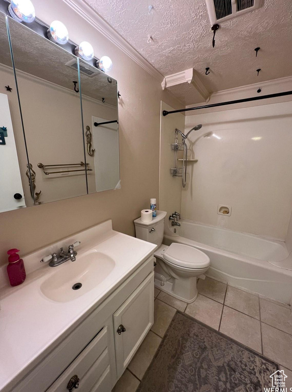 Full bathroom featuring shower / bathtub combination, tile patterned floors, toilet, vanity, and ornamental molding