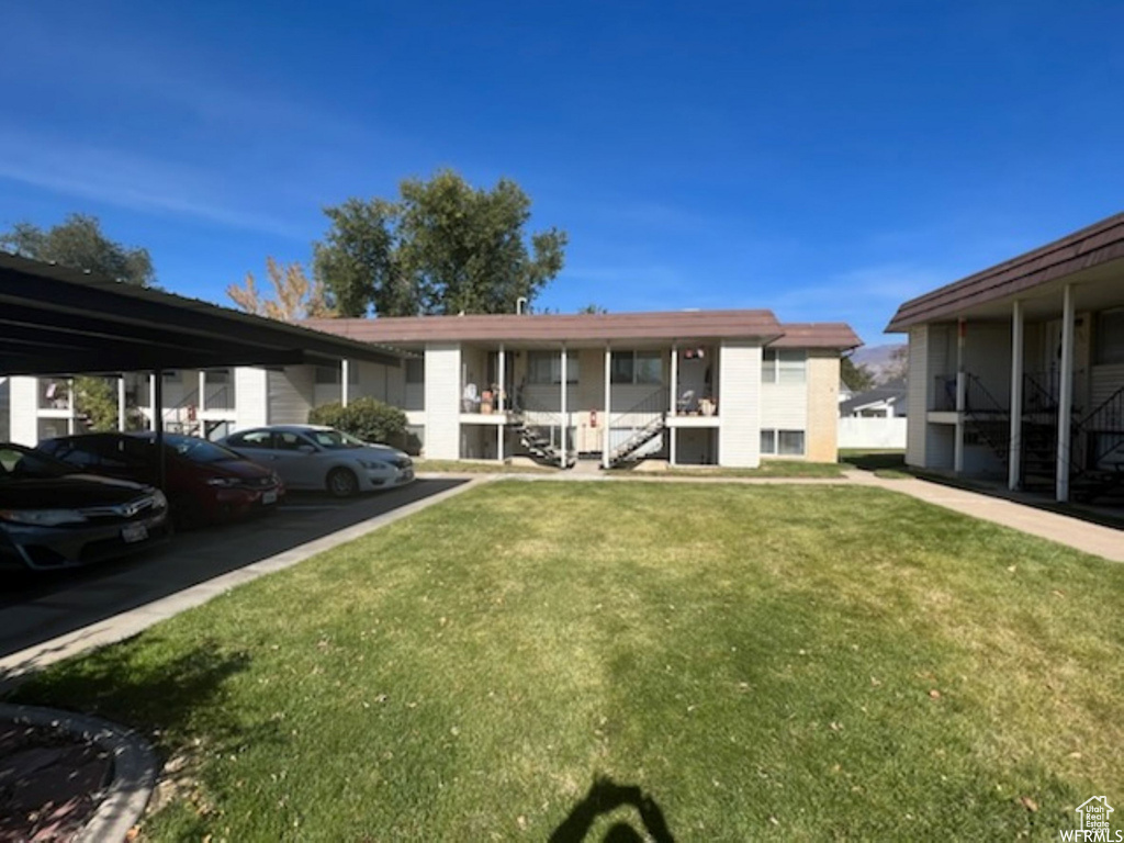 Exterior space featuring a lawn