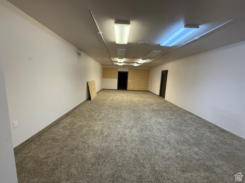 Unfurnished room with light carpet and visible vents