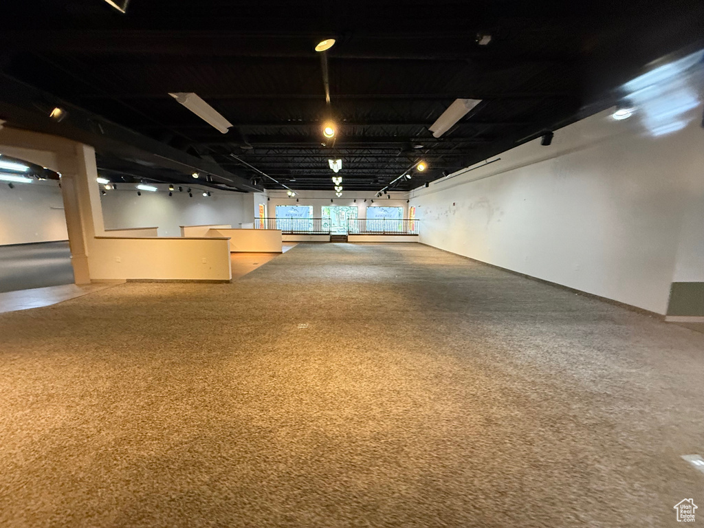 Basement featuring carpet