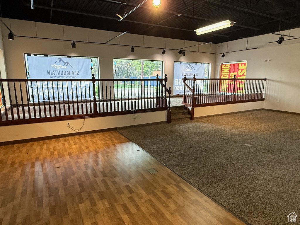 Interior space with baseboards and wood finished floors