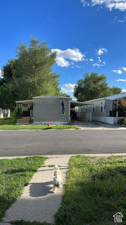 View of front of property with a carport