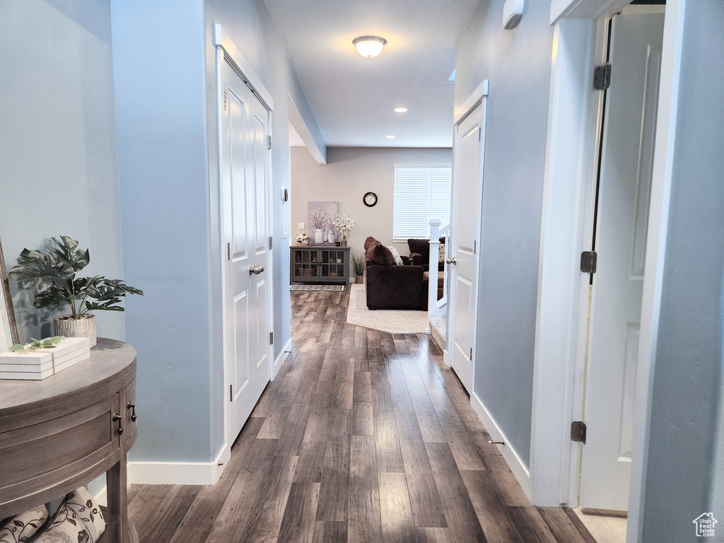 Corridor with dark wood-type flooring