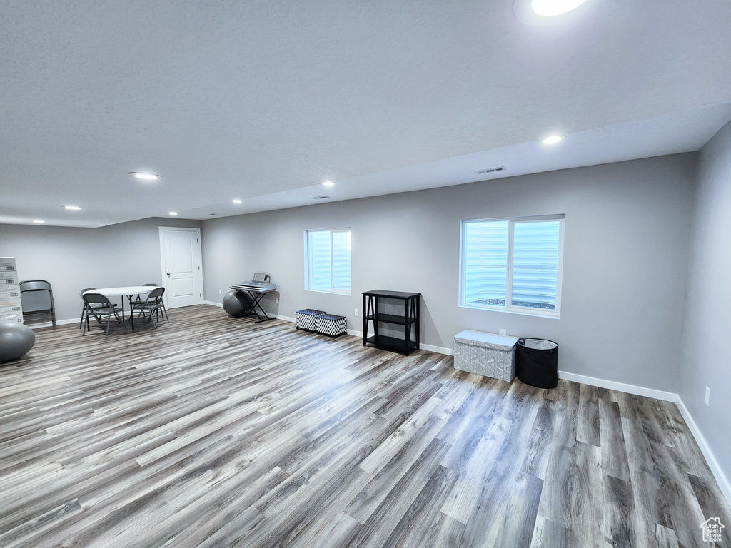 Unfurnished living room featuring wood-type flooring