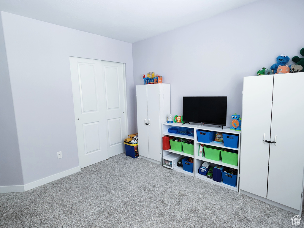 Rec room featuring light colored carpet