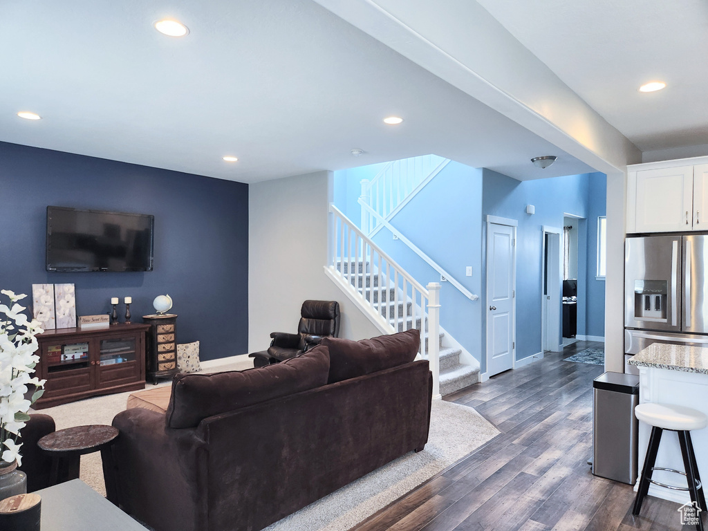 Living room featuring dark wood-type flooring