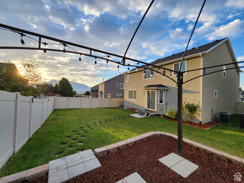 Yard at dusk with central AC