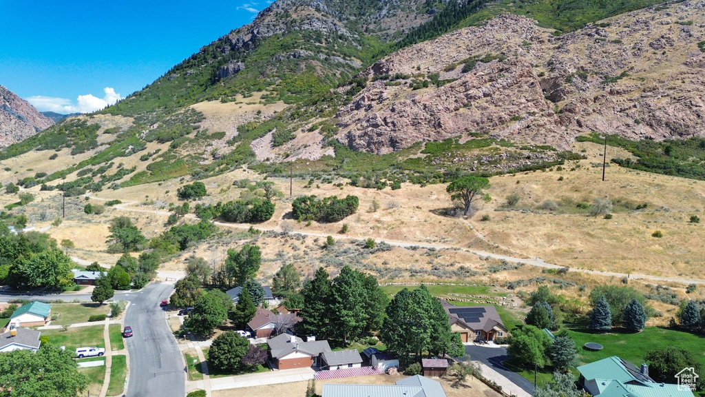 Birds eye view of property with a mountain view