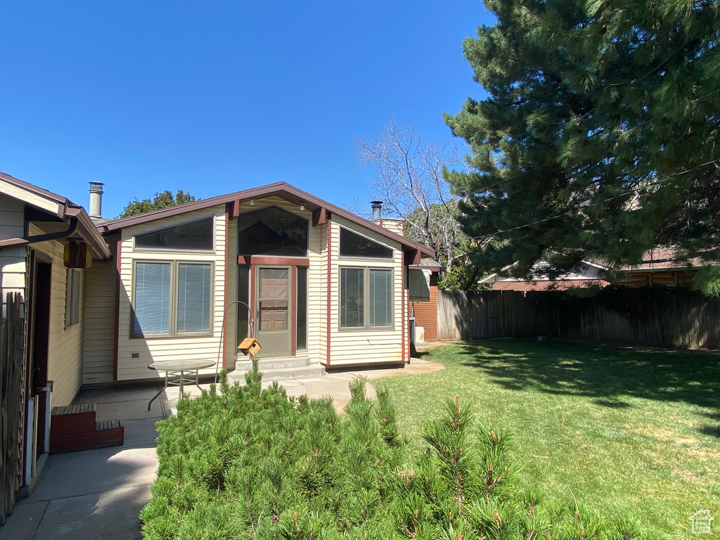 Bungalow-style home featuring a front yard