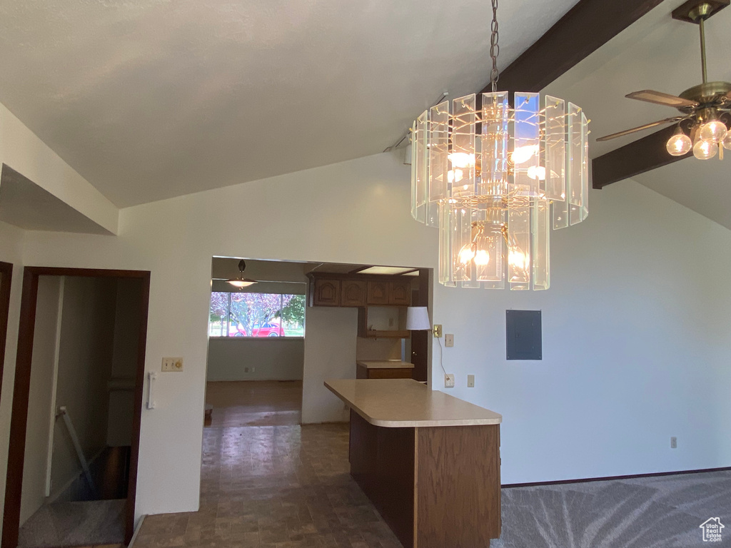 Kitchen with ceiling fan with notable chandelier and vaulted ceiling with beams