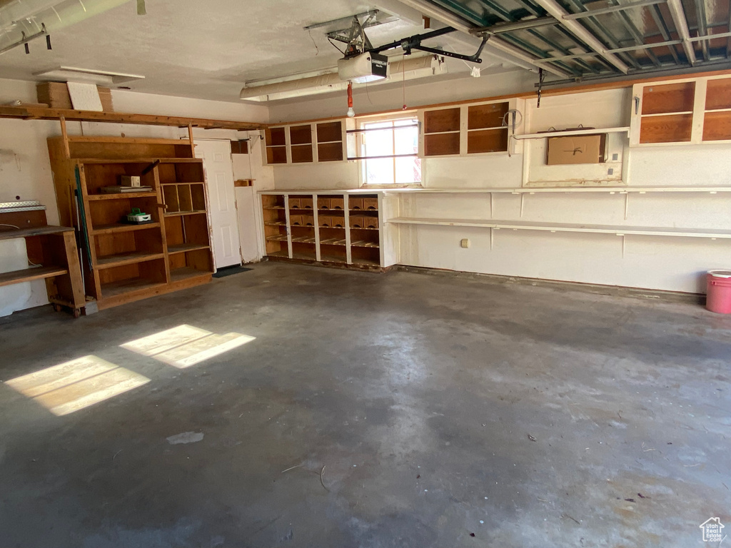 Garage featuring a garage door opener