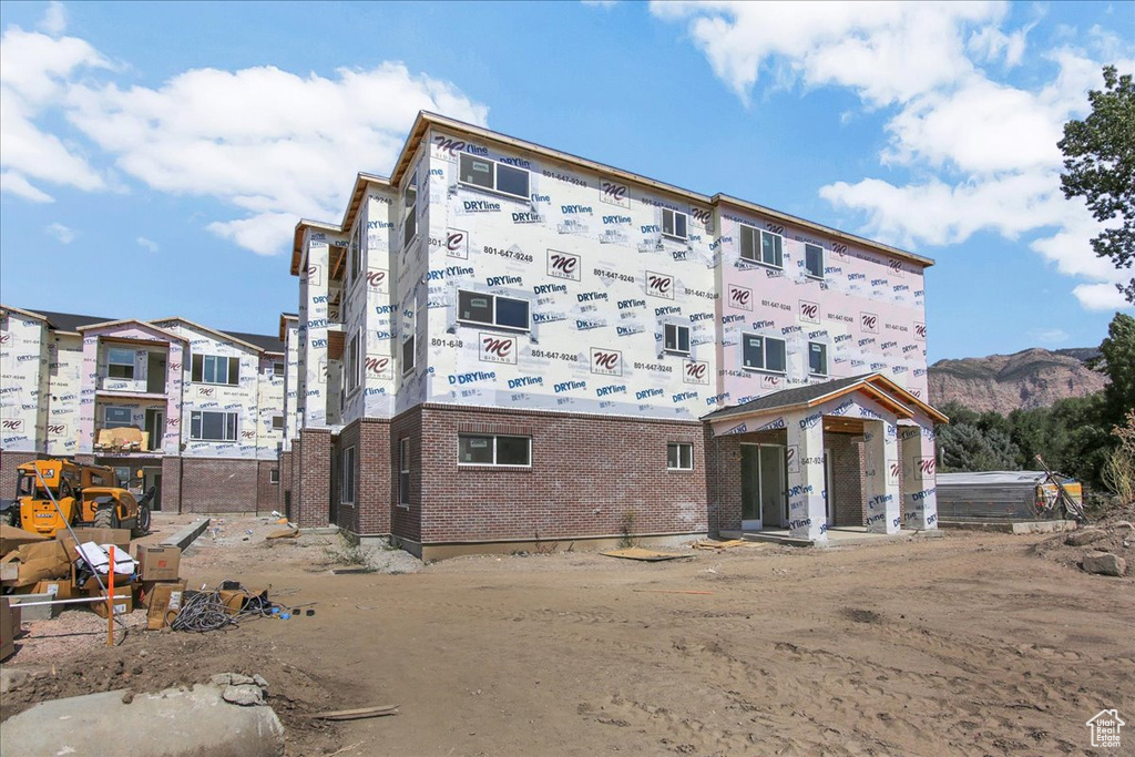 Rear view of house with a mountain view