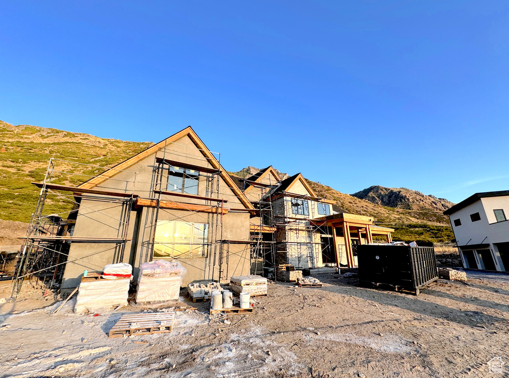 Property in mid-construction with a mountain view