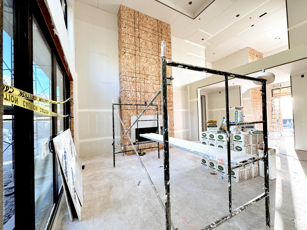 Interior space featuring plenty of natural light and concrete flooring