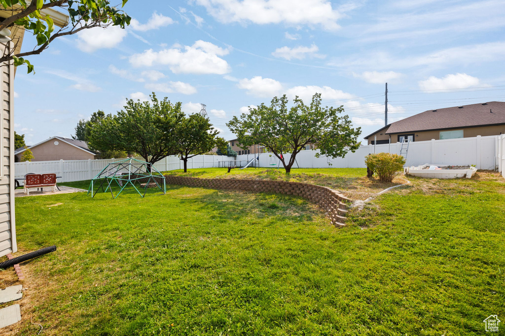 View of yard featuring a playground