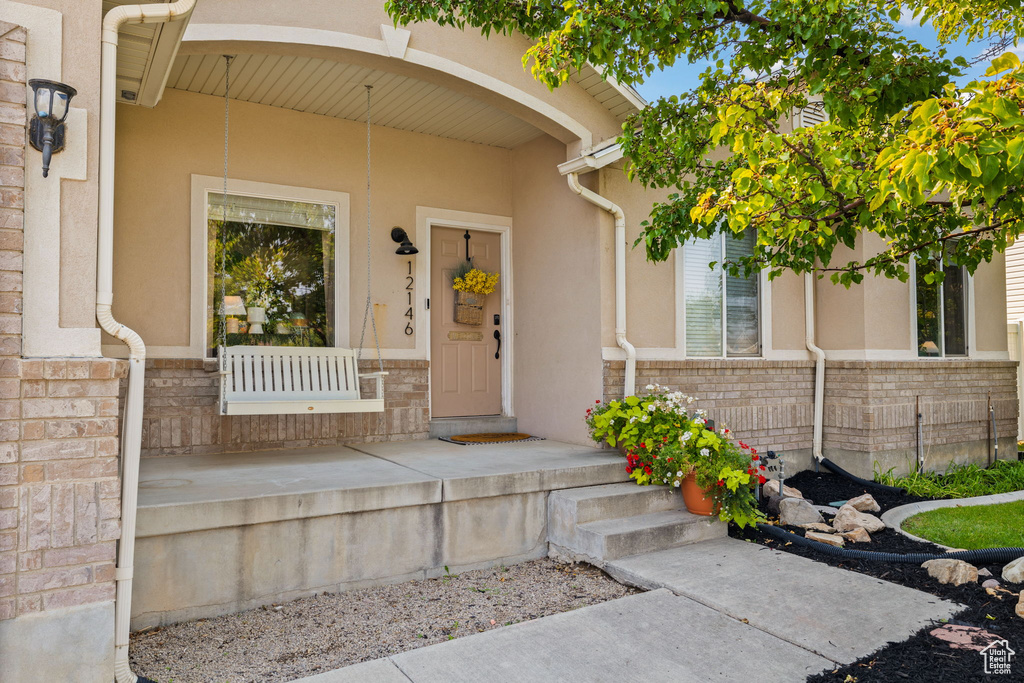 Entrance to property featuring a porch