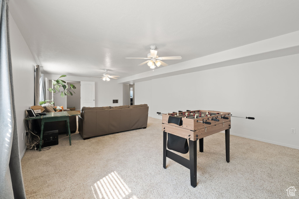 Playroom with light colored carpet and ceiling fan