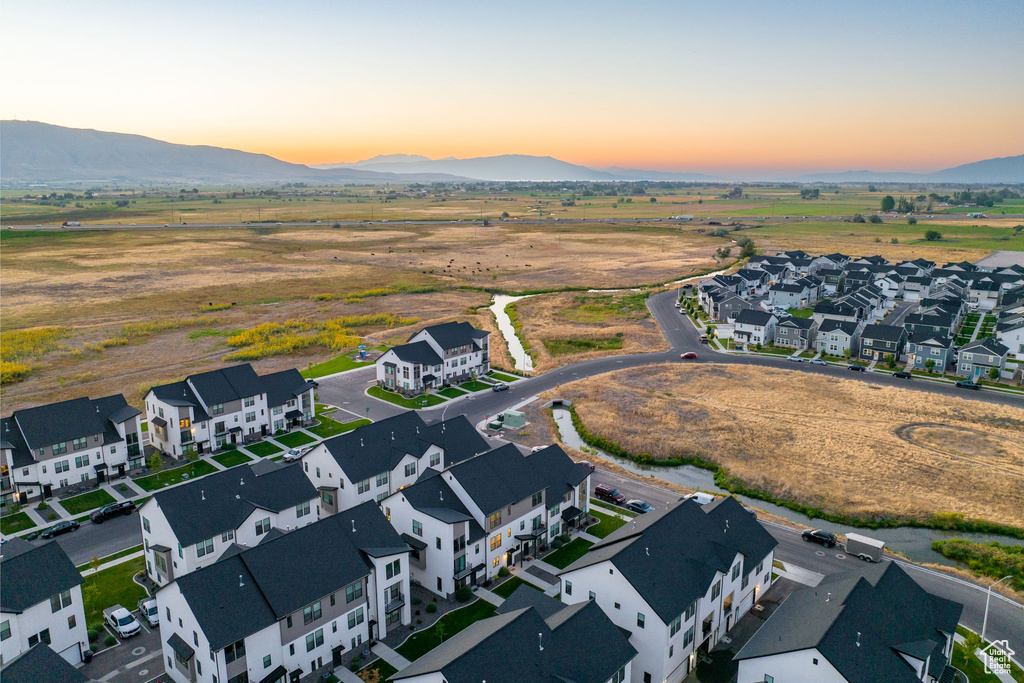 Aerial view at dusk featuring a mountain view