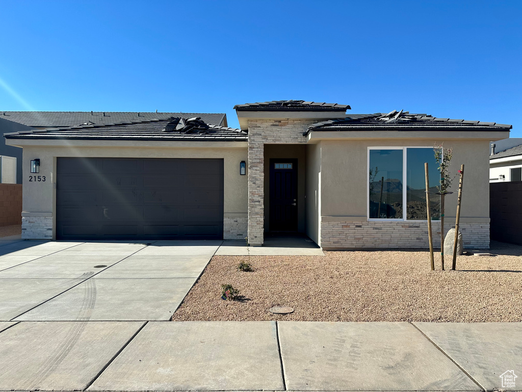 Prairie-style house featuring a garage