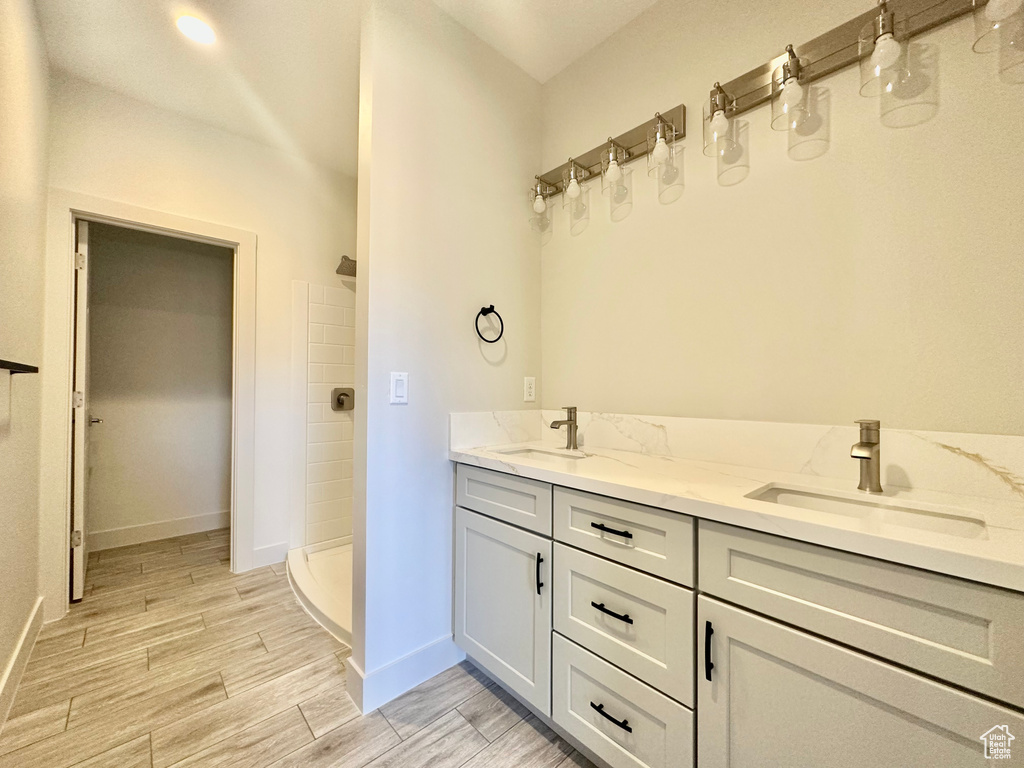 Bathroom with walk in shower and vanity