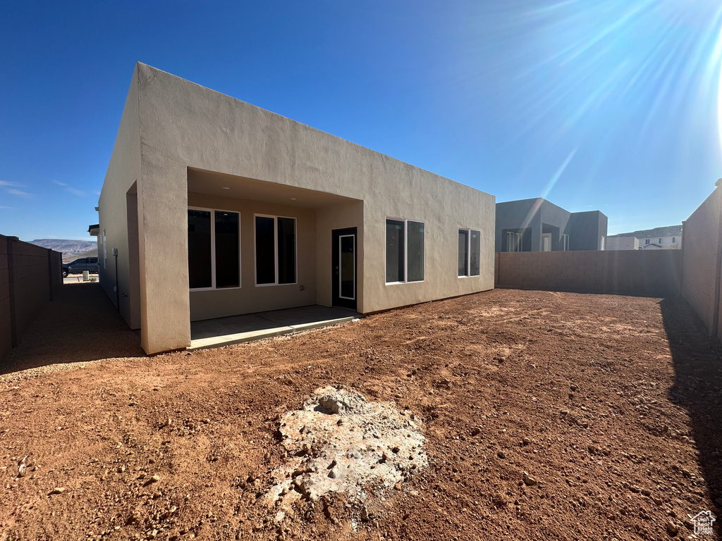 Rear view of property featuring a patio area