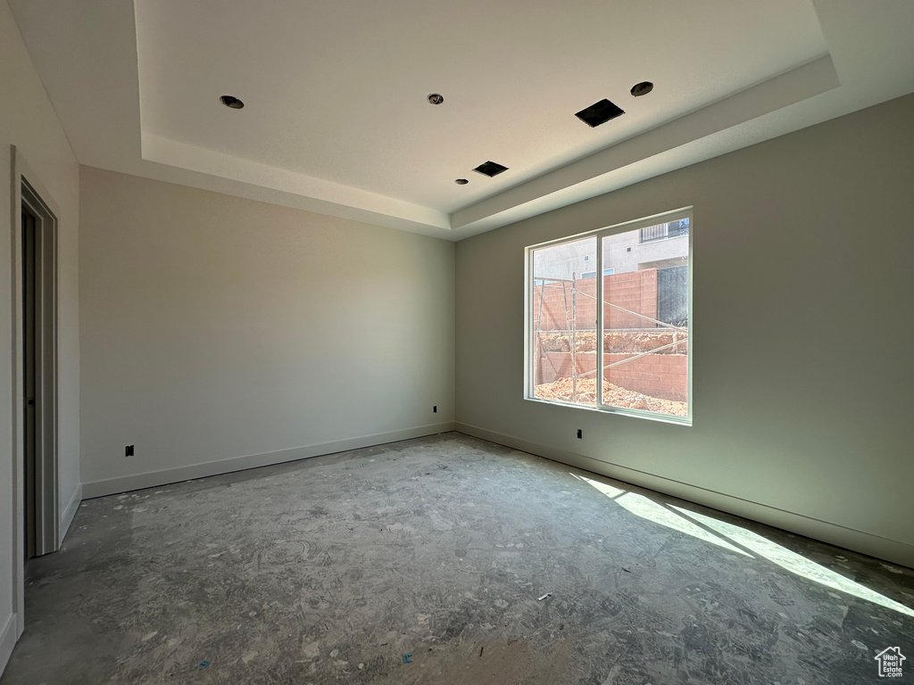 Spare room with a tray ceiling