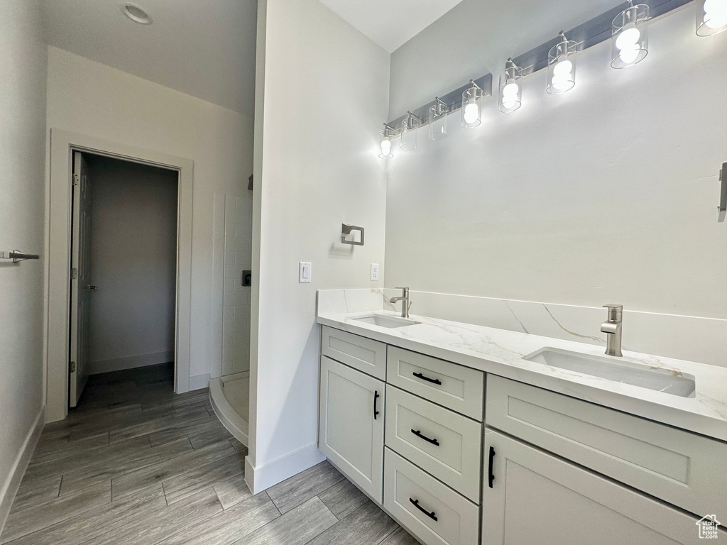 Bathroom with walk in shower and vanity