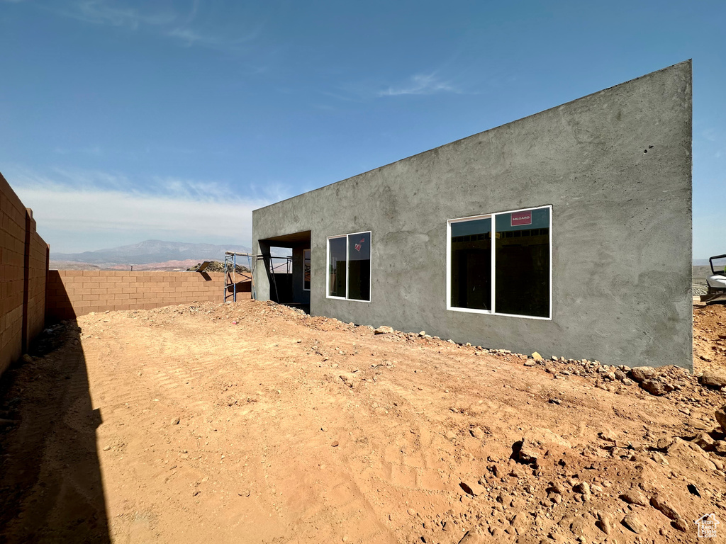 Back of property featuring a mountain view