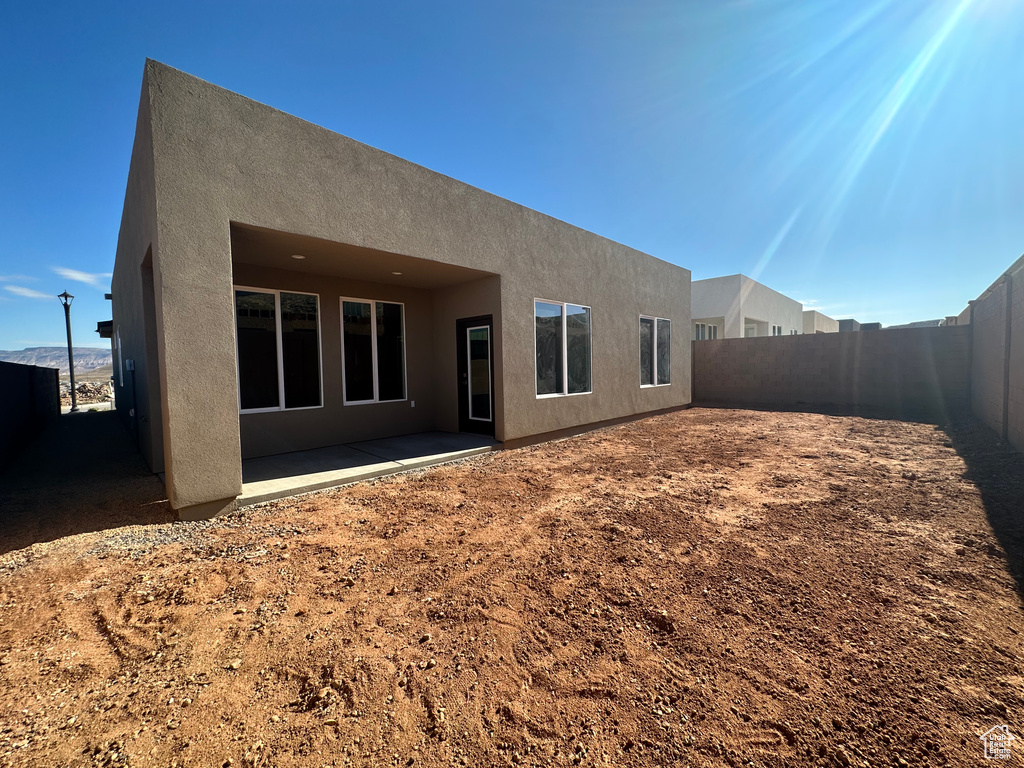 Rear view of house with a patio area