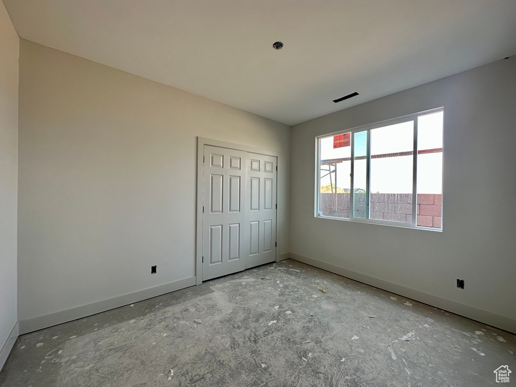 Unfurnished bedroom with a closet