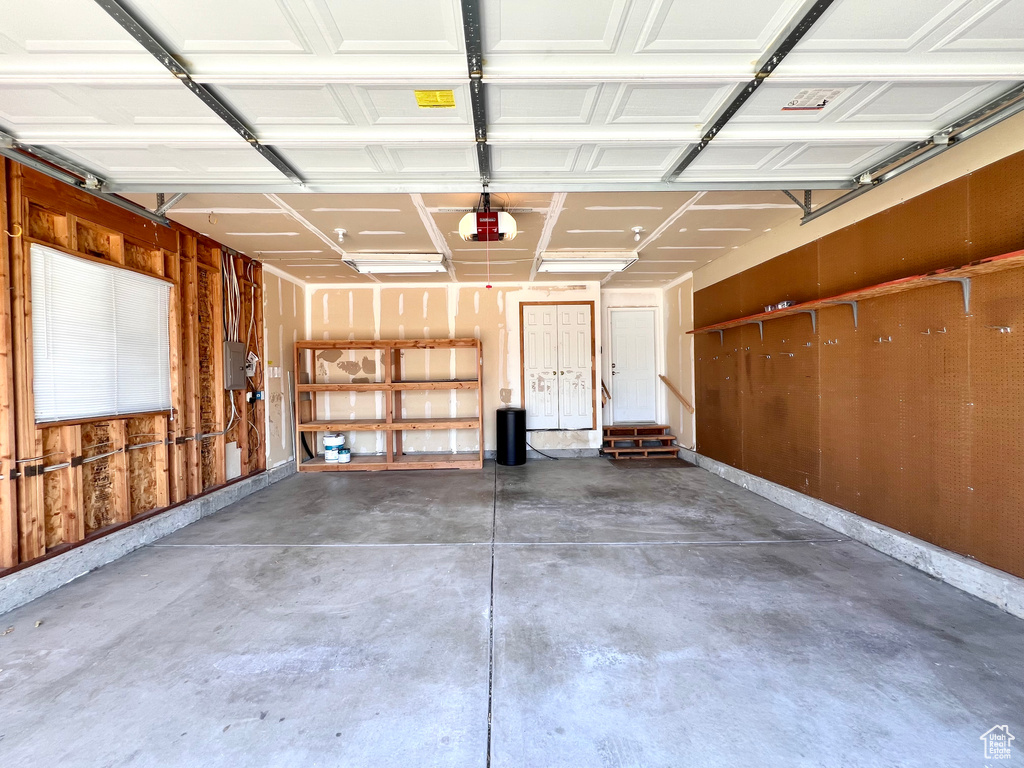 Garage featuring a garage door opener