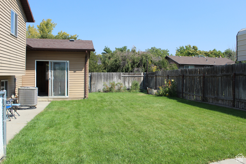 View of yard featuring central AC