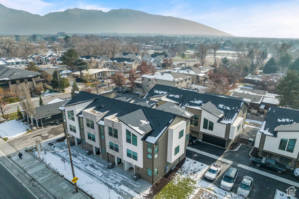 Snowy aerial view featuring a mountain view