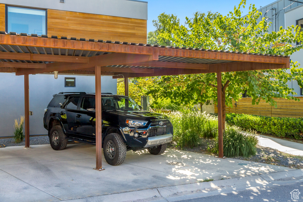 View of car parking featuring a carport