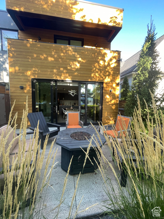 View of patio / terrace with a fire pit