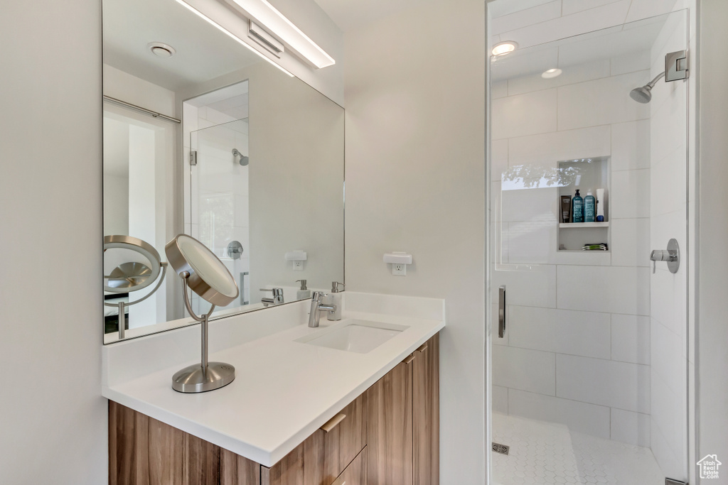 Bathroom with walk in shower and vanity