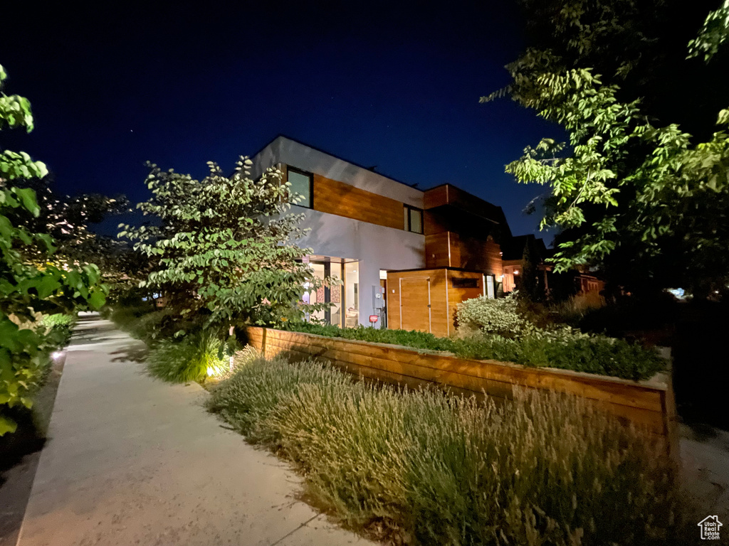 View of property exterior at twilight