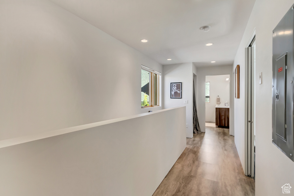 Corridor with light hardwood / wood-style floors