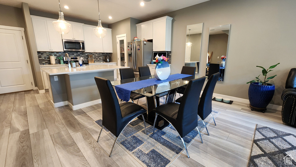 Dining area featuring light wood-type flooring