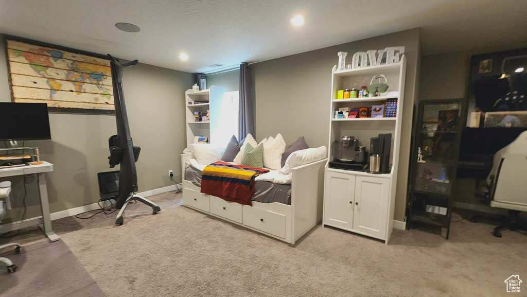 Carpeted bedroom featuring a textured ceiling