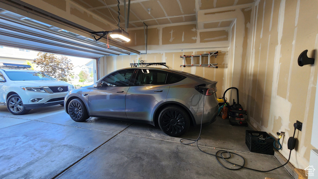 Garage featuring a garage door opener