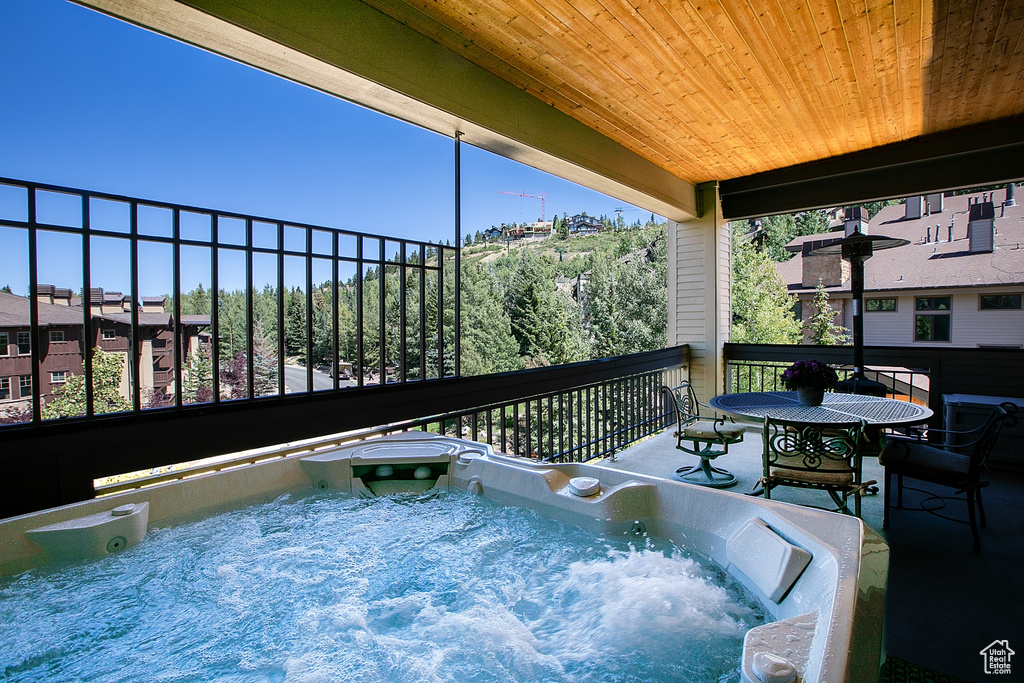 View of pool featuring a hot tub