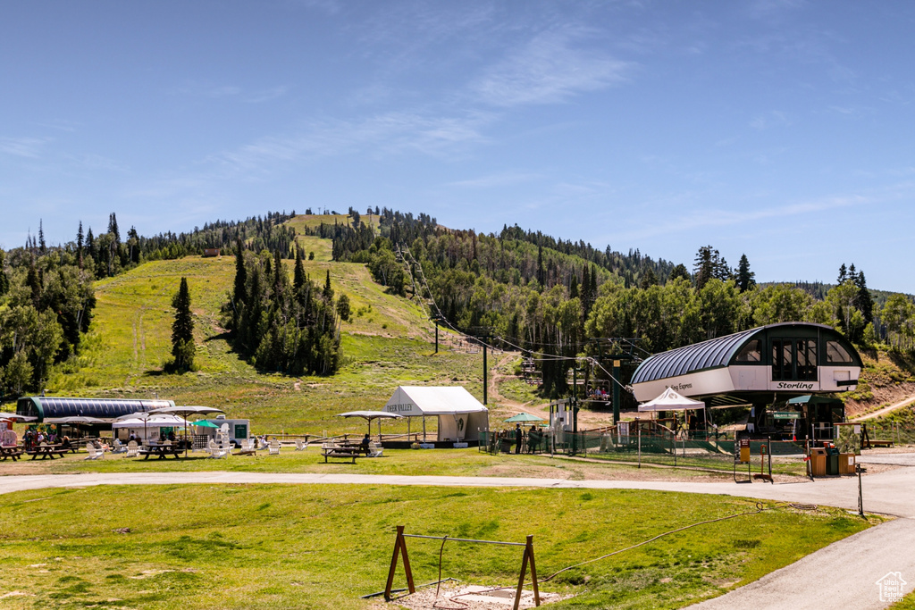 View of property's community featuring a yard