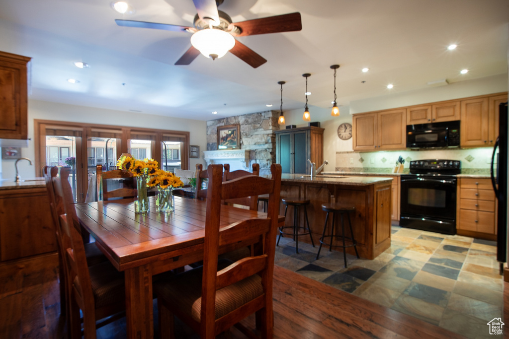 Dining area with ceiling fan