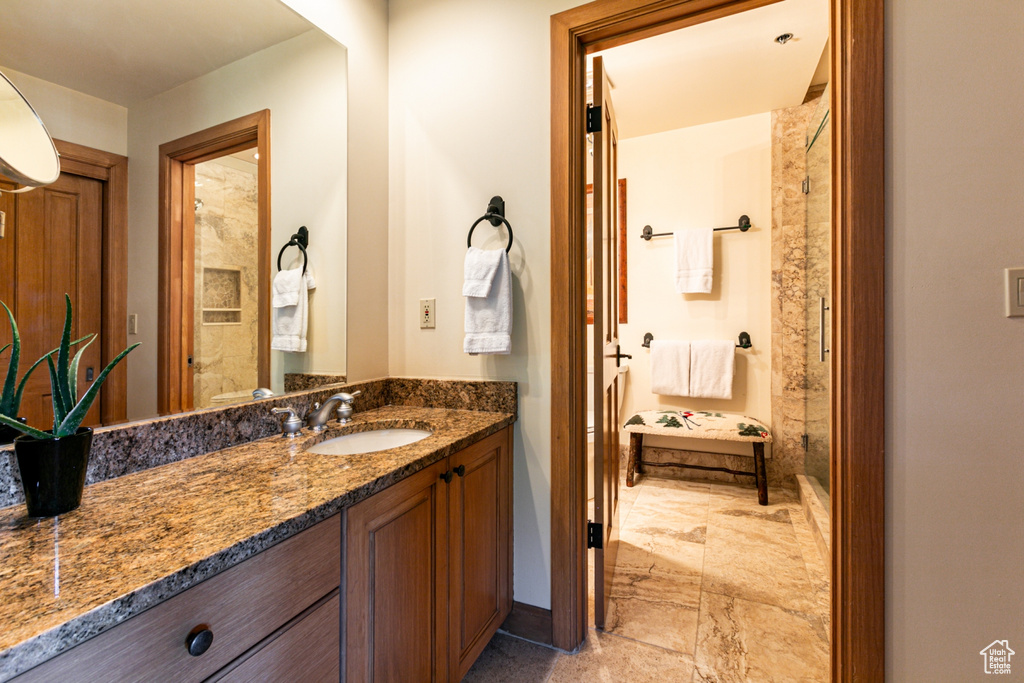 Bathroom with vanity and a shower