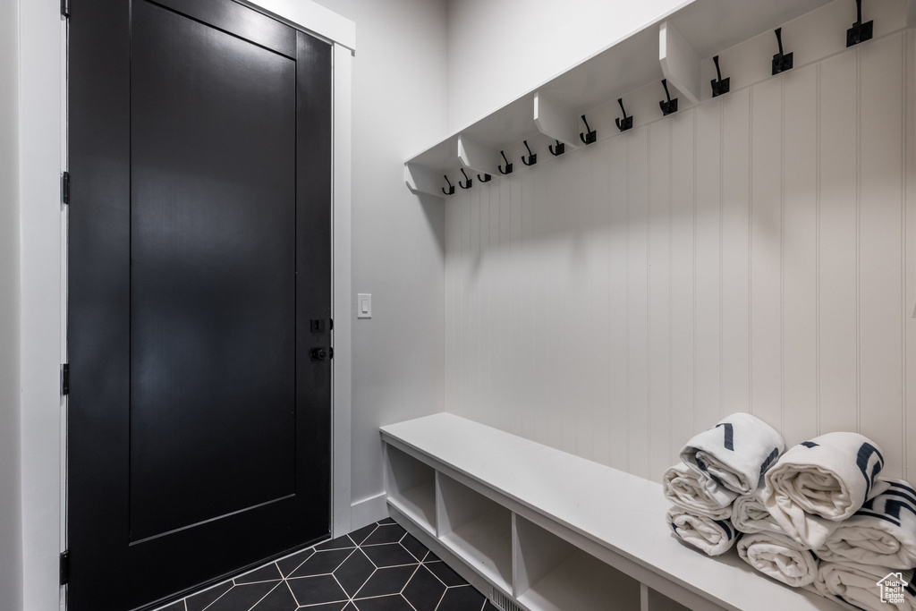 Mudroom featuring dark tile patterned flooring