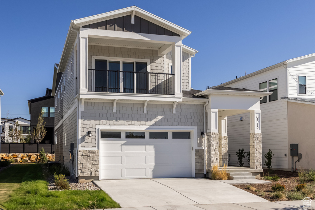 View of front of property featuring a garage