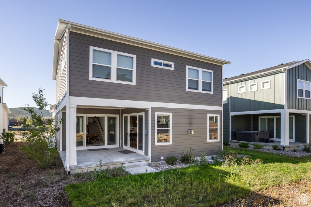 Rear view of house with a patio area