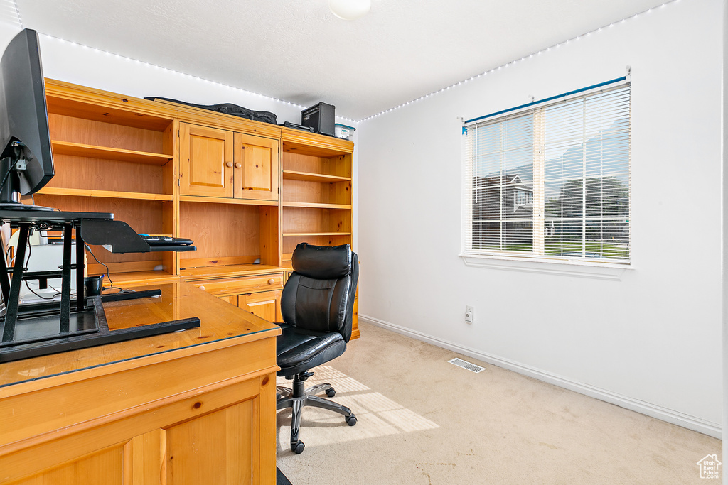 View of carpeted home office